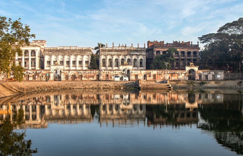 Historic Baliati Zamindar Palace in Bangladesh reflecting in a calm pond. A perfect symmetry.